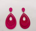 Pair of pink earrings on a light gray background